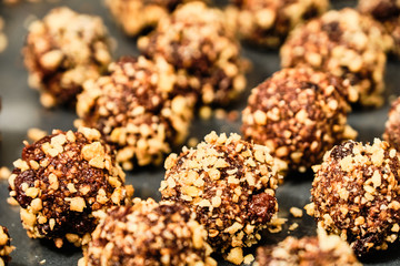 Chocolate balls in grated walnuts