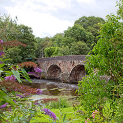 Fototapeta na wymiar Ancient stone bridge over the River Exe at Bickleigh, Devon, England, UK. (HDR)