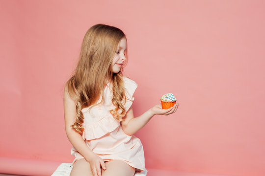 little girl eating cake with cream cupcake sweet