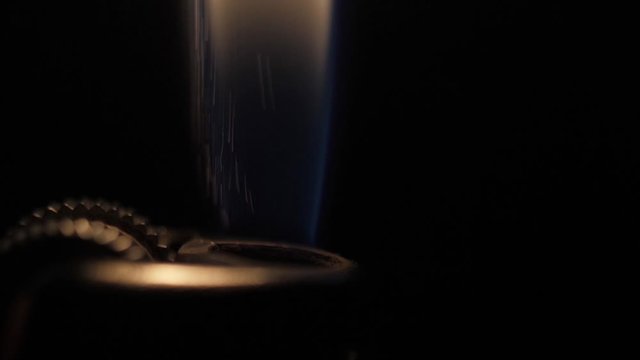 ignite cigarette lighter black background slow motion