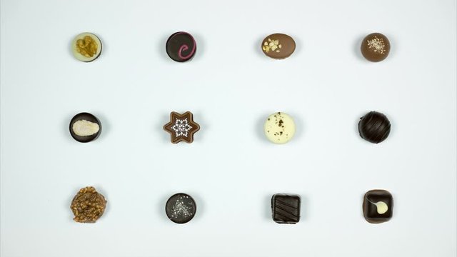 Luxury chocolate candies on white background. Set of chocolate sweets. Stop motion
