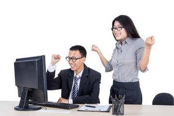 Fototapeta na wymiar Asian business couple cheering for finished tasks
