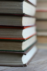 books in color covers close up stacked in a row