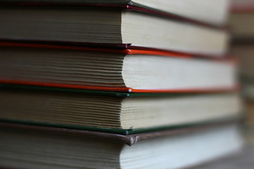 educational books in colored covers laid out in a row