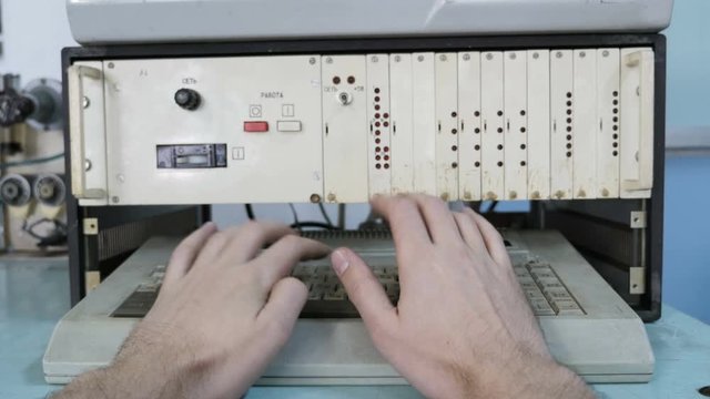 Man Typing On Old Keyboard