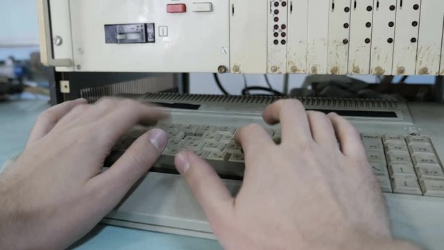 Hands Of  Young Man Typing On A Computer Keyboard