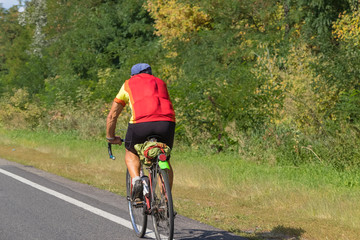 Cyclist rides on the highway on a bicycle