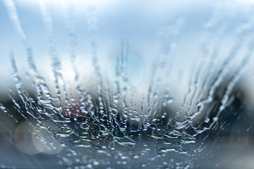 drops of water and bokeh on a car windshield