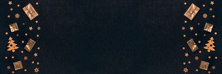 Christmas and New Year background with golden gift boxes and ornaments. Extra wide panorama banner background