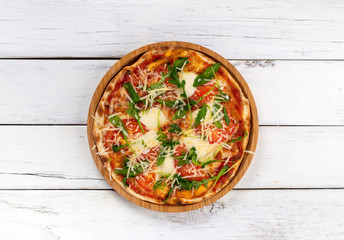 Italian pizza margherita with mozzarella tomatoes and herbs