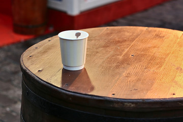 Paper Cup on the table in a street cafe