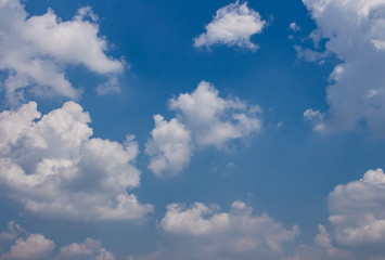 many white clouds against the blue sky