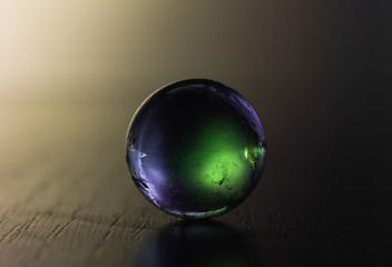 Glass ball in colours. Crystal ball in abstract colours. Magic ball.
