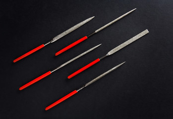 different diamond file set on black background