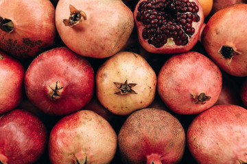 Tasty ripe fresh pomegranates background. Useful vitamins food.