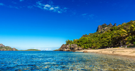 Obraz premium View of the sandy beach of the island, Fiji. Copy space for text.