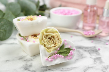 Natural handmade soap bars on marble table