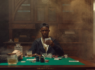 Poker player plays in casino