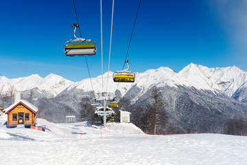 snow mountain glade with ski lifts
