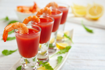 Shrimp cocktail with tomato sauce on table, closeup. Space for text
