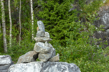 The heap of stones called CAIRN in the Ruskeala Park, Republic of Karelia, Russia. This stack indicates the right way