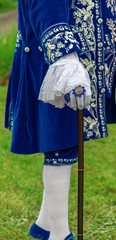 A man standing in mask and masquerade costume (part) in Annevoie  gardens, Belgium - 311239378