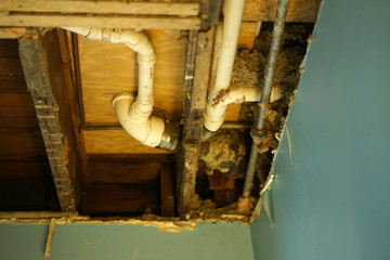 Water pipes into old ceiling.