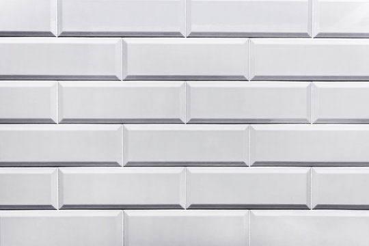 Ceramic white brick, decorative wall texture, tile closeup © Andrey