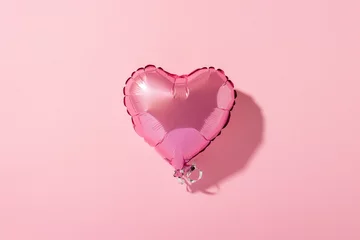 Foto op Aluminium Air balloon heart shape on a pink background. Natural light. Banner. Concept love, wedding, photo zone. Flat lay, top view © Alex
