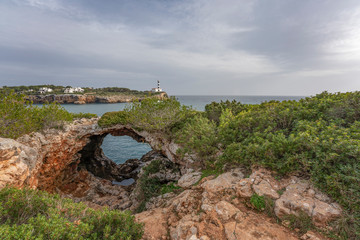 Fototapeta na wymiar Lighthouse of Portocolom, Majorca island, Mediterranean Sea, Mallorca Spain