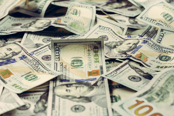 Dollar notes are lined up on a table close-up, a texture of dollar bill.