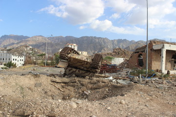 A tank belonging to Al-Houthi militia after being damaged by the Popular Resistance in Jabal Sabr in Taiz City 
