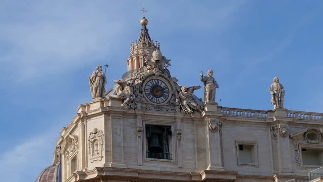 Old bronze bells singing motion on st peter basilic in rome,vatican city