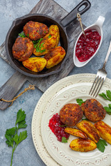 Homemade meat cutlets and baked potatoes.