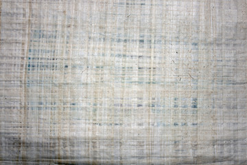 Papyrus simulated paper texture closeup. The structure of the old porous paper. Paper texture pattern as abstract background.