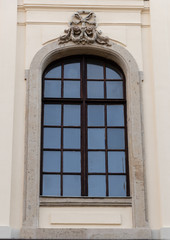 Fototapeta na wymiar Window with decorated stone frame