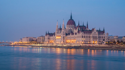 Hungarian Parliament building and Danube River in the Budapest city in the evening. A sample of neo-gothic architecture.