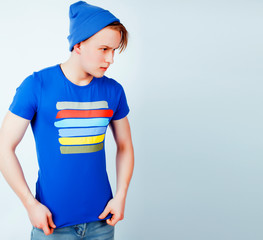 young handsome teenage hipster guy posing emotional, happy smiling against white background isolated, lifestyle people concept