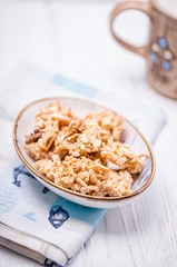 Homemade cookies with walnuts and peanuts on a white wooden background. Copy space