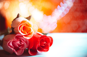 Blooming roses on a bokeh background. Celebration concept. Valentine's day. Space for text