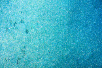 Fototapeta na wymiar Turquoise blank background with gradient and spots. Paper texture.