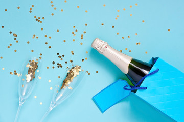 Celebration background - top view of two crystal champagne glasses and bottle