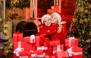 Obraz na płótnie Canvas santa kids with present box. Find presents online. Christmas together. What a great surprise. happy little girls. xmas celebration mood. sisters love family holiday. Wishing a happy New Year