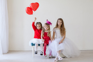 Children with red balloons on birthday party