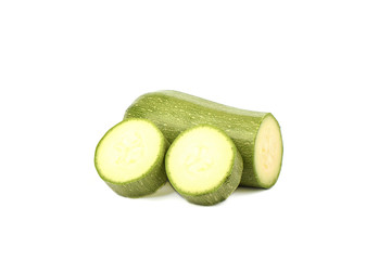 Green ripe squash cut into slices isolated on a white background.