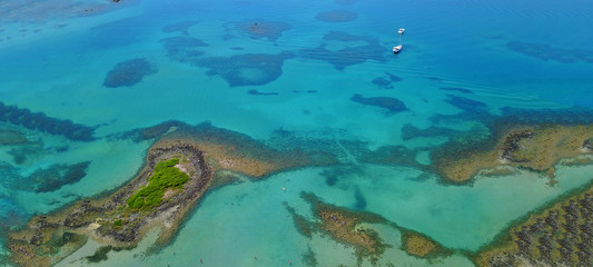 Fototapeta na wymiar Aerial drone top view ultra wide photo of tropical exotic paradise located in Pacific ocean island