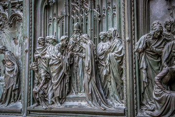 Details of the external bas-reliefs of Milan Cathedral (Duomo di Milano). Milan, Italy