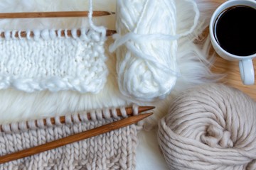 Fototapeta na wymiar knitting on needles in neutral colours 
