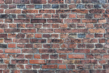 Fototapeta premium Rough, textured, old brick wall