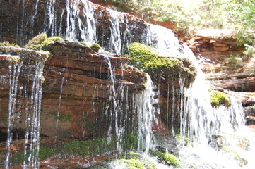 Hiking through red rocks and emerald pools